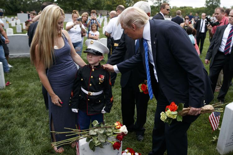 PHOTOS: Trump hails the fallen and their families at Arlington