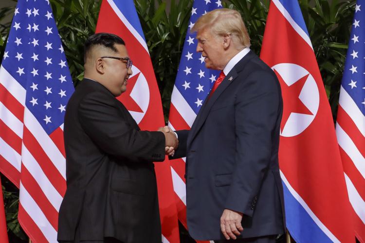 Trump-Kim shake hands, commit to ‘complete denuclearization’