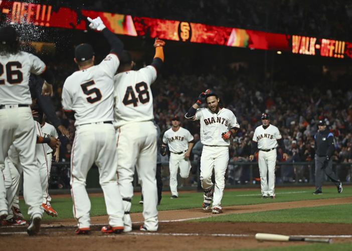 Crawford’s 9th-inning home run lifts Giants past skidding Rockies