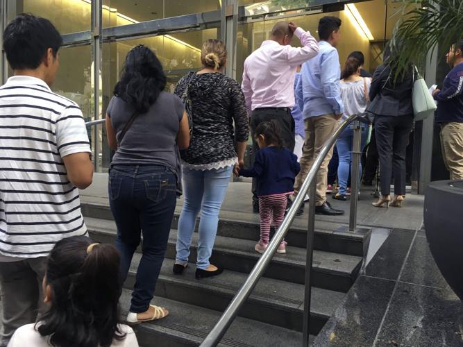 US to reunite migrant families as immigration politics boil