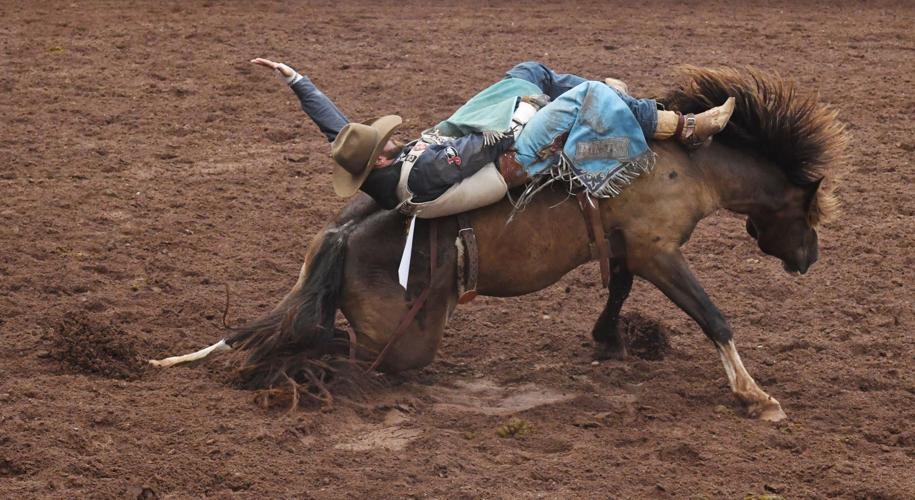 Pikes Peak or Bust Rodeo’s Weston Rutkowski runs from the most reckless – the Spanish bull