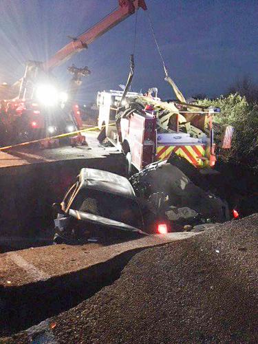 Storm aftermath: Sinkhole swallows firetruck and two cars, flooding inundates Pikes Peak region