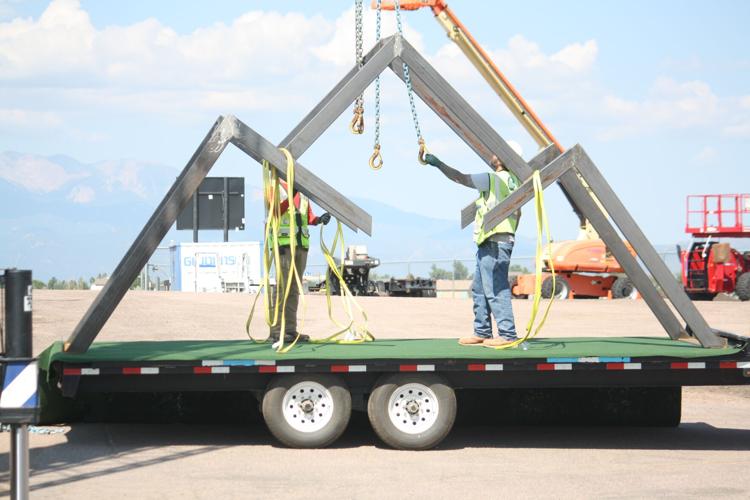 Workers put finishing touches on ‘America the Beautiful’ parade float as Colorado Springs prepares for 150th birthday party