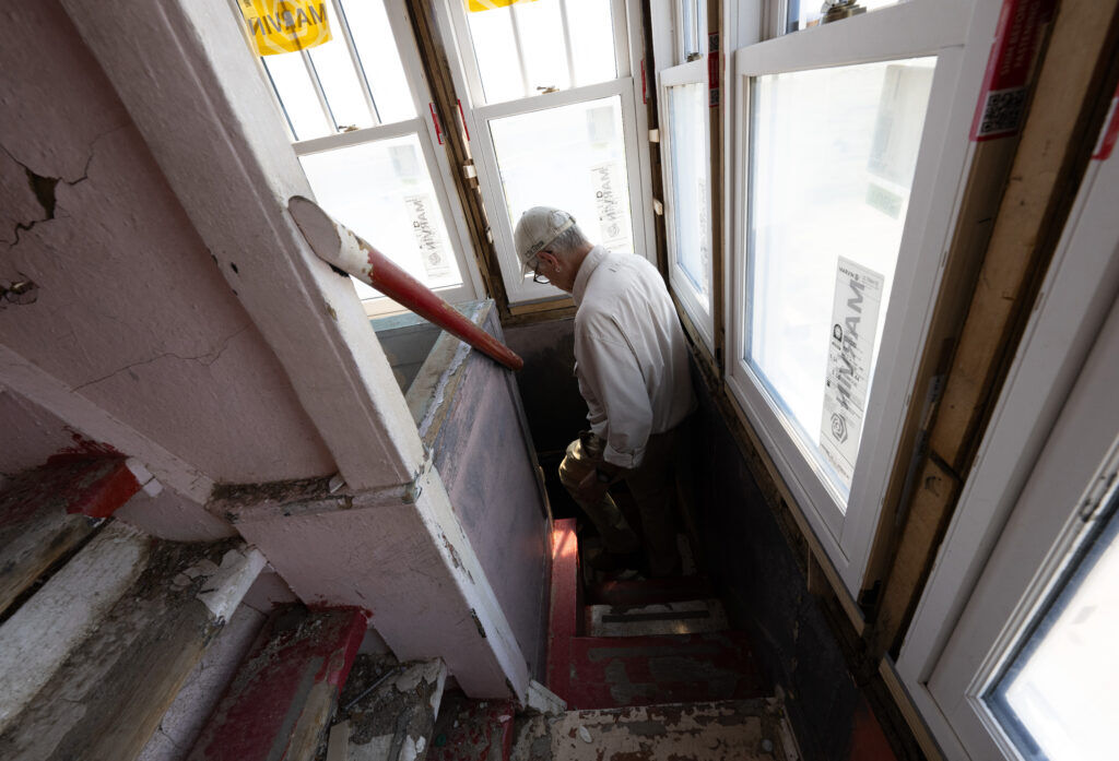Reed Weimer descends the steep stairs of the 65-foot World's Wonder View Tower in Genoa, Colo., Thursday, Aug. 14, 2025. (The Gazette, Christian Murdock)