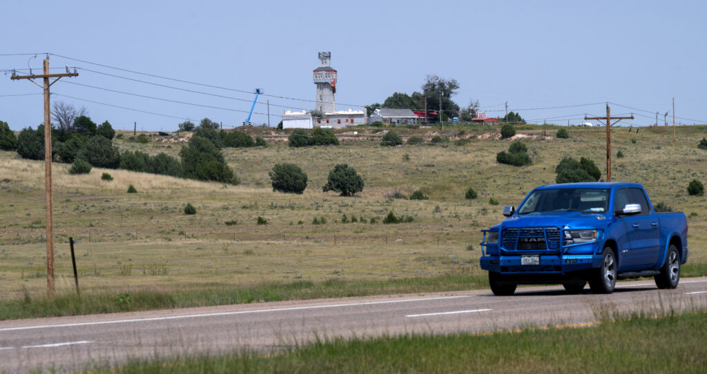 A truck drives west on Interstate 70 Thursday, Aug. 14, 2025, with the World's Wonder View Tower in the background. Rigley's Believe it or Not claimed in 1933 that six states could be seen from the top of the 65-foot tower. The tower was built in 1926 by Charles Gregory. (The Gazette, Christian Murdock)