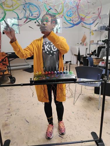 Green Box artist plays music with paint