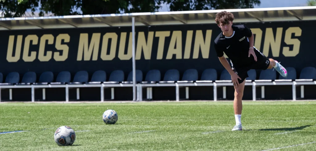 University of Colorado Colorado Springs midfielder Aidan Harris stretches before practicing Aug. 12 at Mountain Lion Stadium in Colorado Springs.