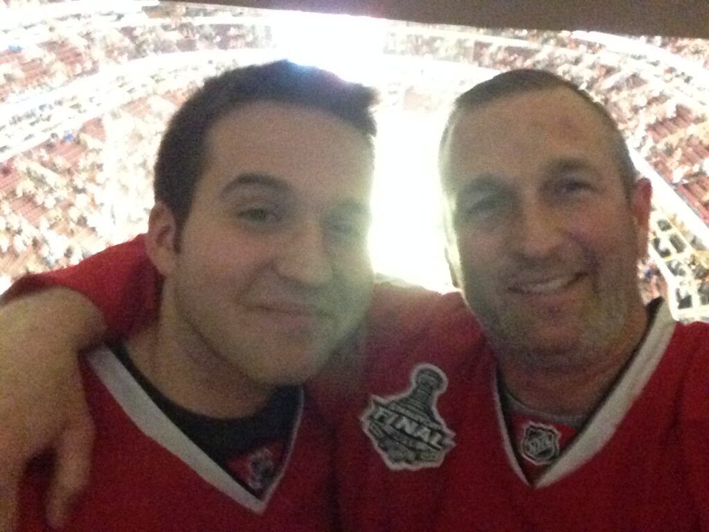 Michael John Patrick Lynch and his father Mike Lynch (right) at a hockey game.