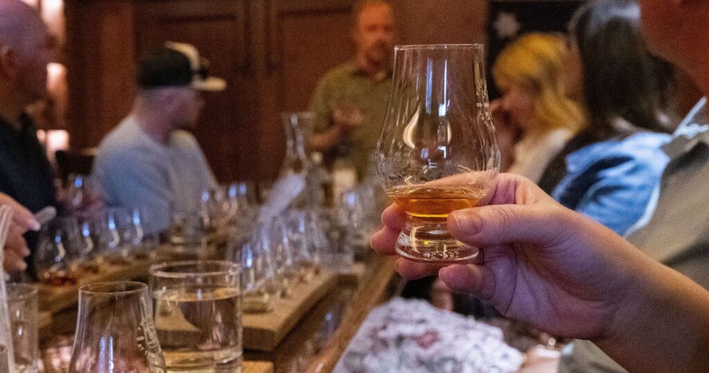 Guests sample a pour of whiskey during a tour at The Vault Sunday, July 27, 2025, at The Stanley Hotel in Estes Park. (The Gazette, Christian Murdock)