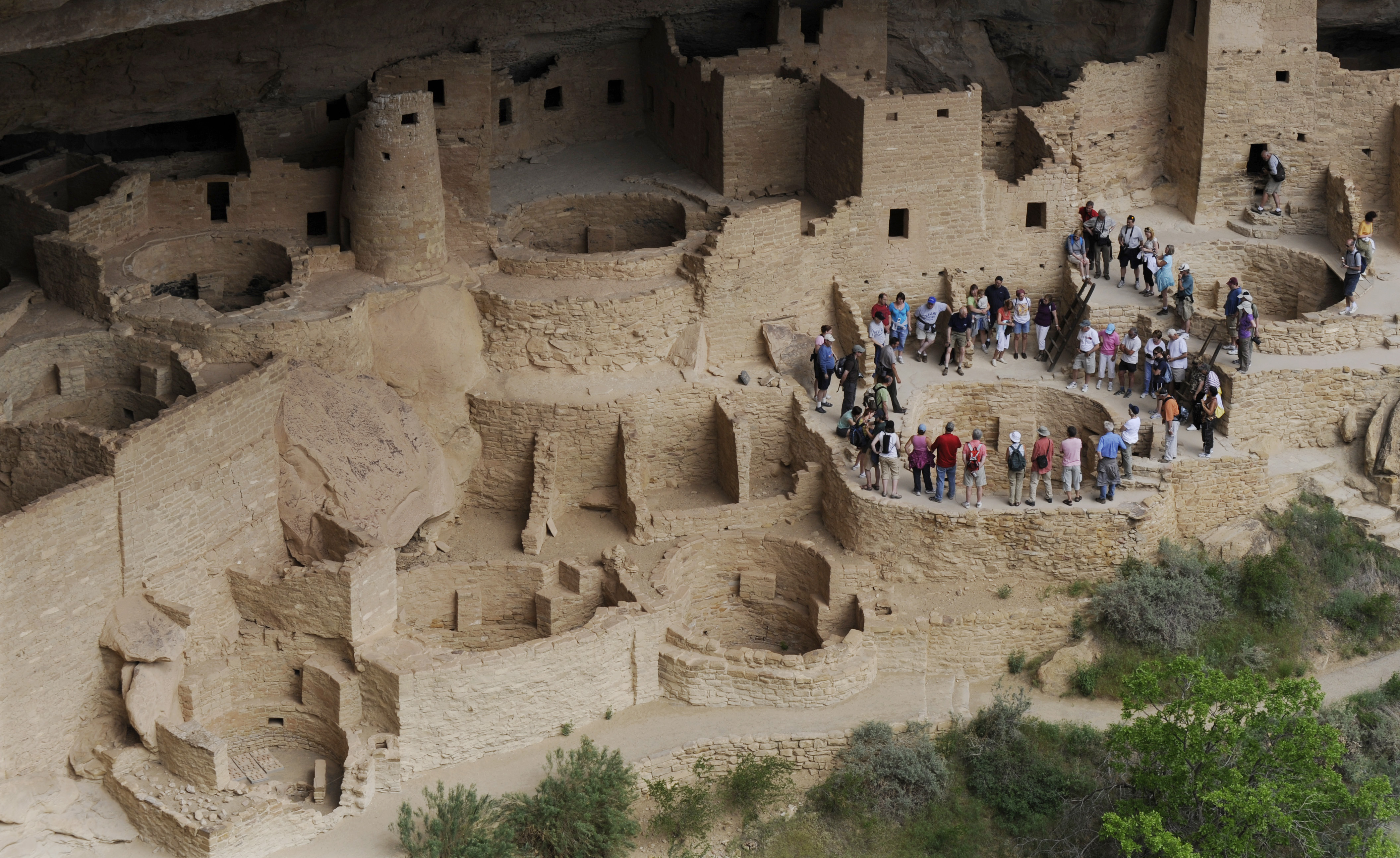 Tourists encircle a kiva while touring the Cliff Palace at Mesa Verde National Park. The Cliff Palace is the largest cliff dwelling at Mesa Verde National Park and in the United States. Jerilee Bennett, The Gazette file (Jerilee Bennett, The Gazette)