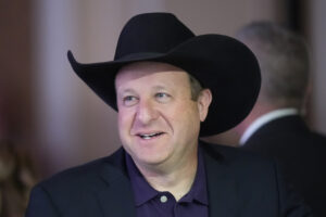 Colorado Gov. Jared Polis arrives at the opening plenary session at the 2024 summer meeting of the National Governors Association, Thursday, July 11, 2024, in Salt Lake City. (AP Photo/Rick Bowmer)